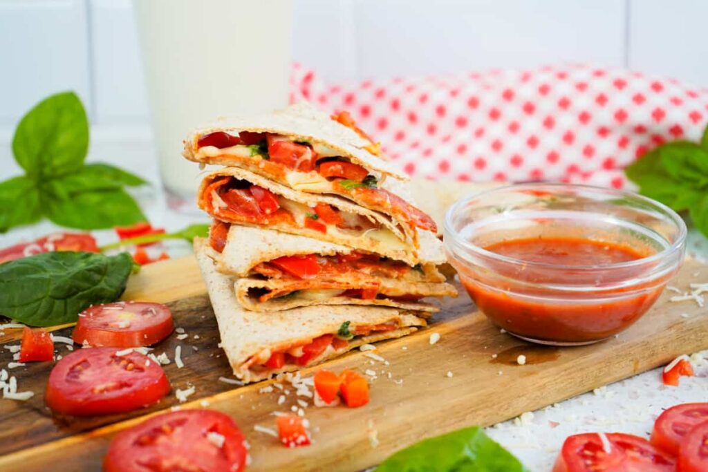 From conventional pepperoni and mozzarella to gourmet combinations like BBQ chicken with red onions and cilantro, the possibilities for creativity are endless. Veggie enthusiasts will enjoy a garden-inspired pizzadilla stuffed with bell peppers, mushrooms, and olives.